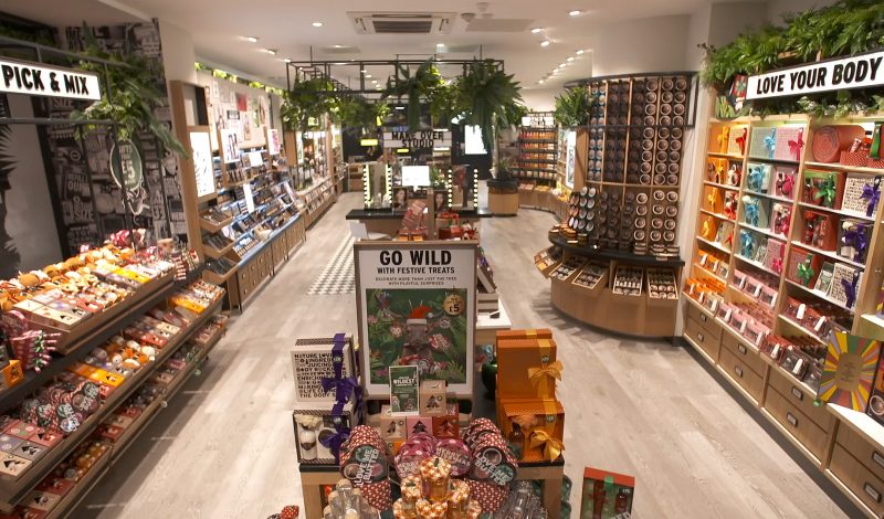 retail design of the body shop store with shelves full of beauty products