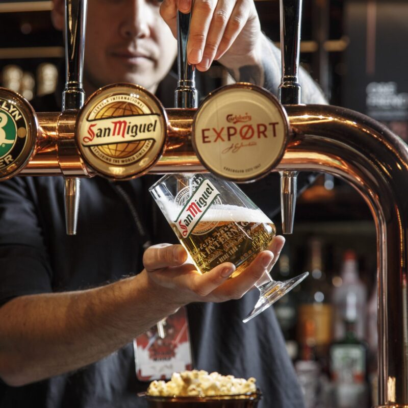Bartender pouring a pint at The Edit Bar in Vue Finchley road location