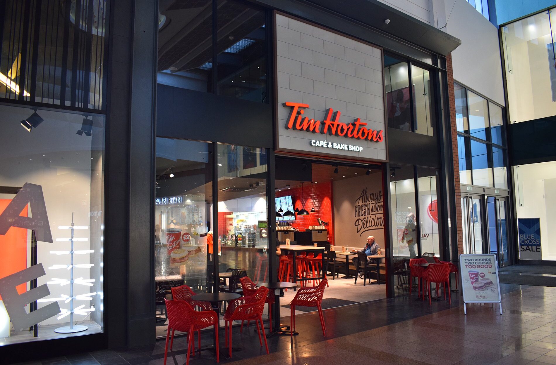 exterior design of tim hortons coffee shop with glass facade