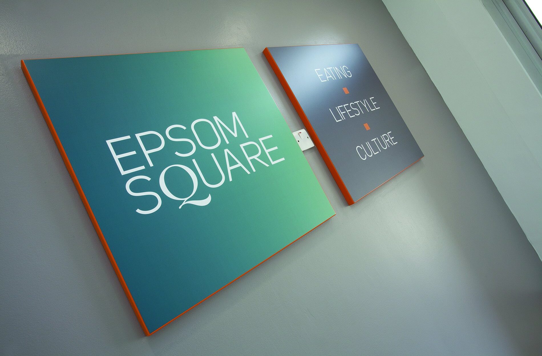 Epsom Square shopping centre signage saying 'Eating. Lifestyle. Culture' Beyond London Eposom Square Shopping Centre Retail Design Asset Enhancement Brand Identity Signage & Wayfinding Customer Experience design