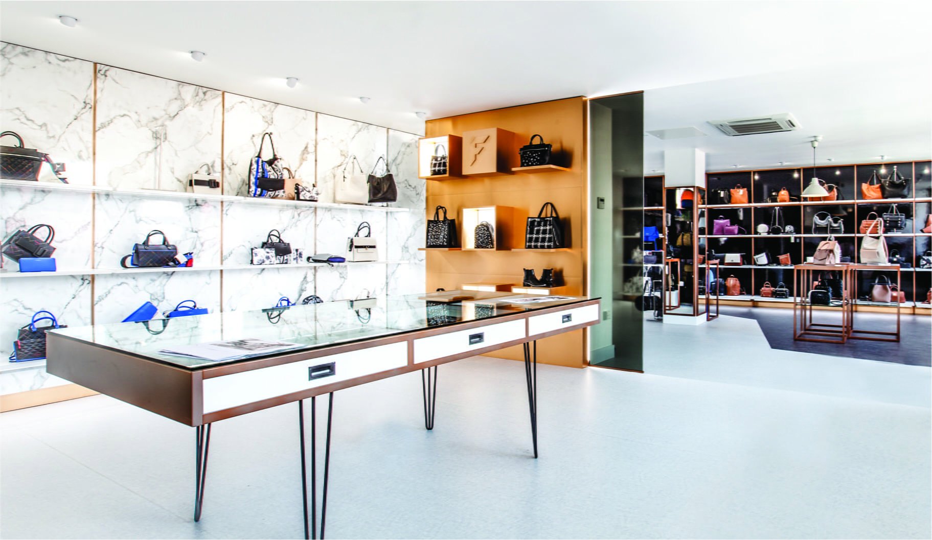 Fiorelli showroom with wall displays of handbags