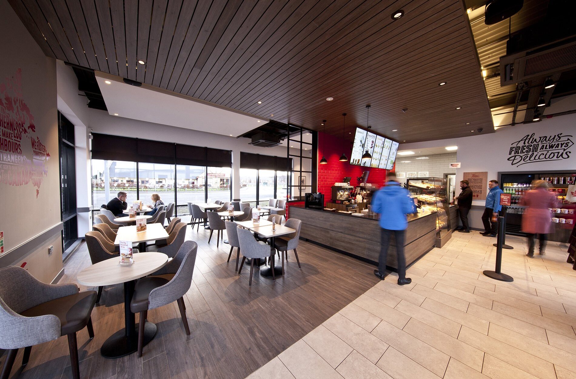 seating area and till counter in tim hortons drive thru coffee shop