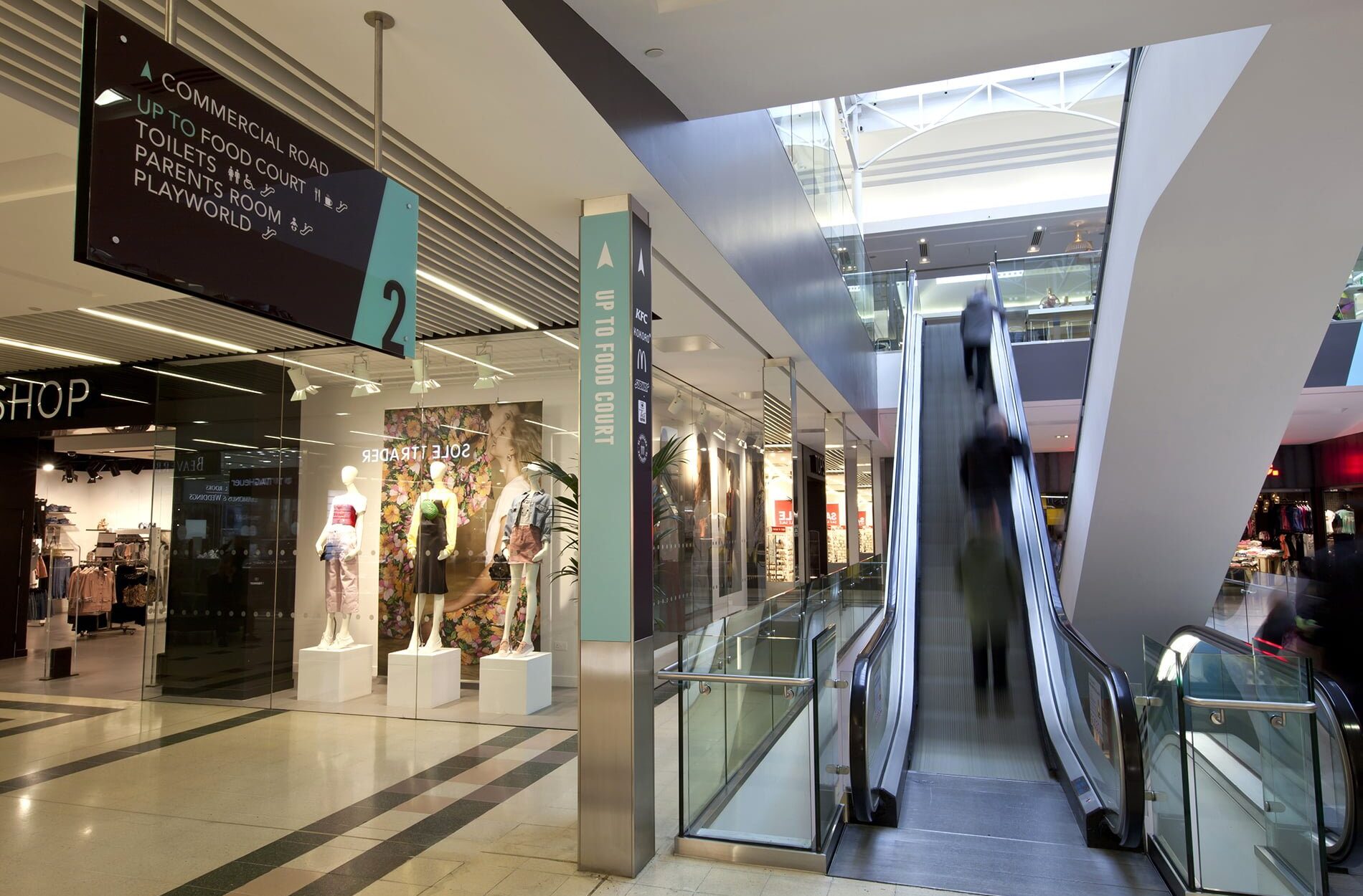 Escalators and way-finding at The Friary shopping centre, Guildford Beyond London The Friary Shopping Centre Brand Identity and Shopping Centre enhancement Retail Design Interipr Design Signage & Wayfinding Customer Experience design