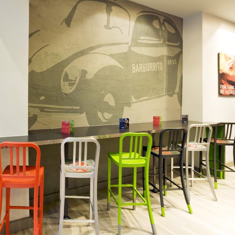 interior design of Barburrito restaurant with wall graphics and colourful furniture