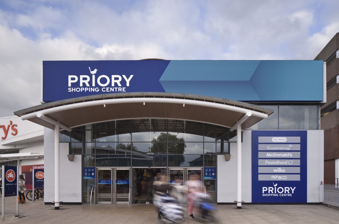 Exterior design of the entrance to Priory shopping centre Beyond London Priory Shopping Centre Asset Enhancement Interior Design Signage & Wayfinding Customer Experience design
